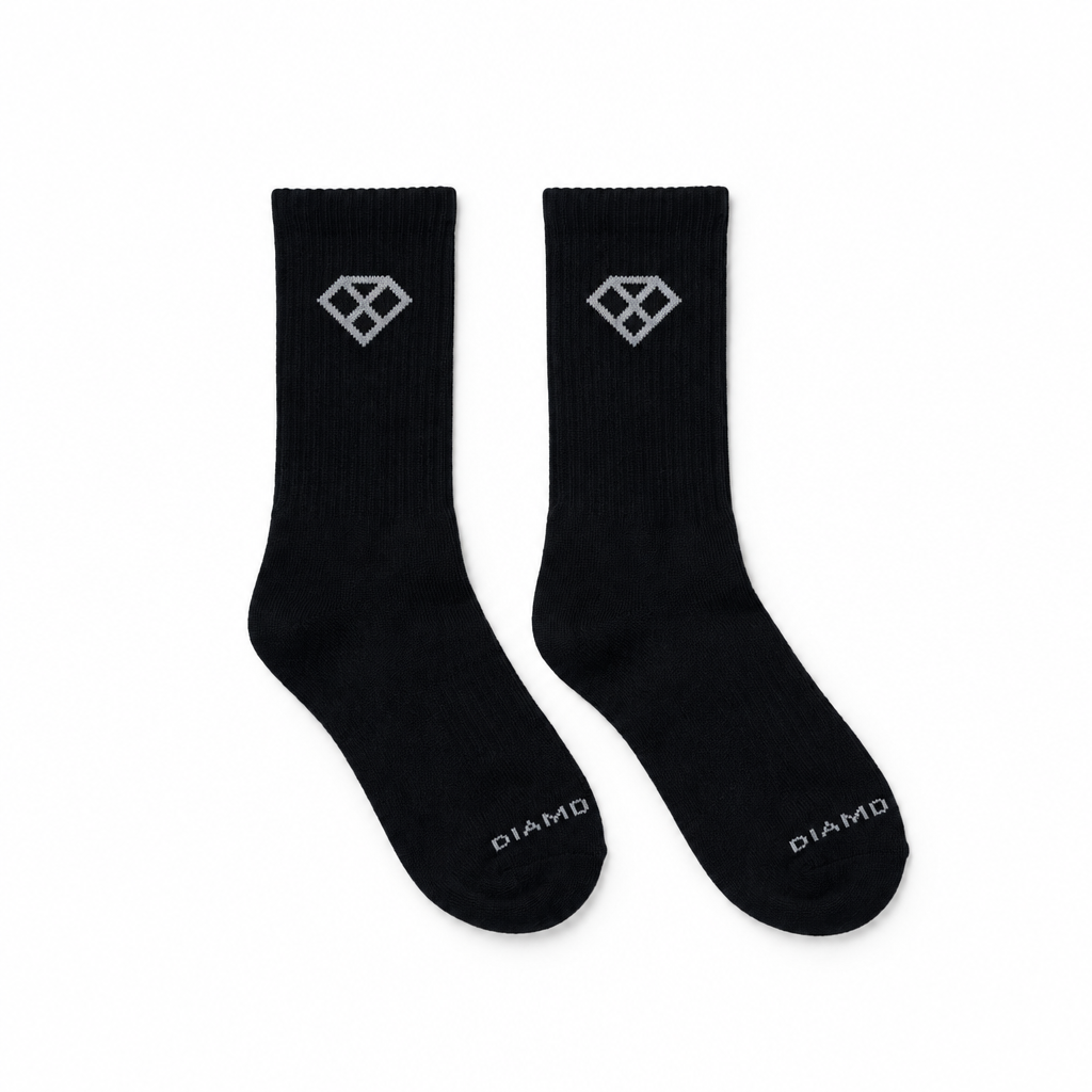 Pair of black crew socks arranged side by side at the same scale and framing as the white sock reference